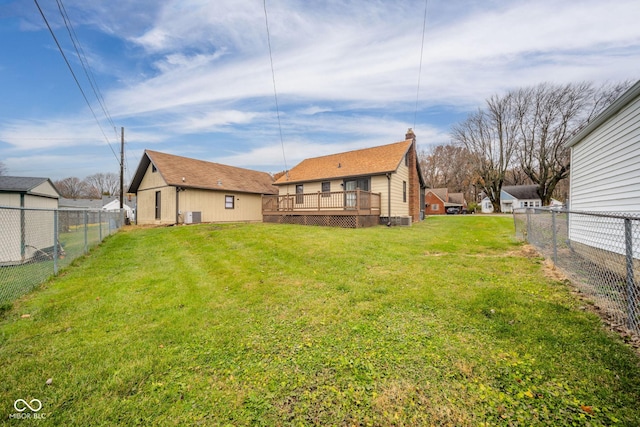 view of yard featuring a wooden deck and cooling unit