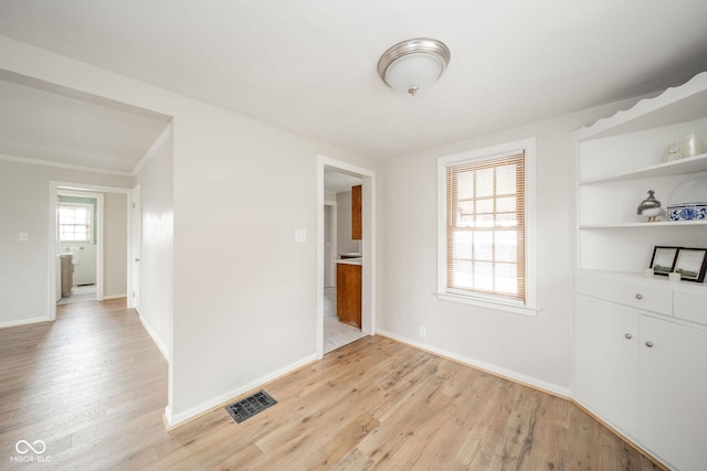 unfurnished room featuring light hardwood / wood-style floors