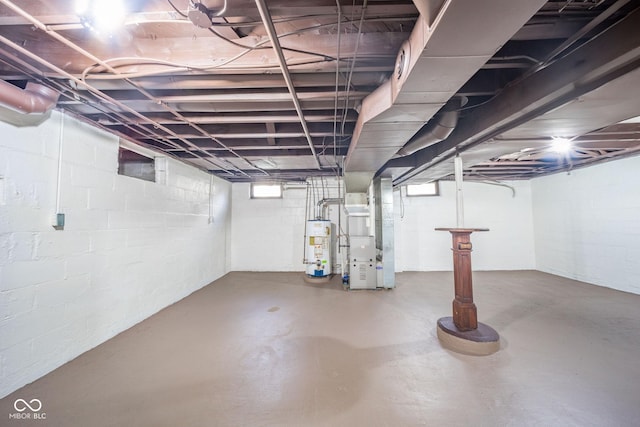 basement with water heater and heating unit