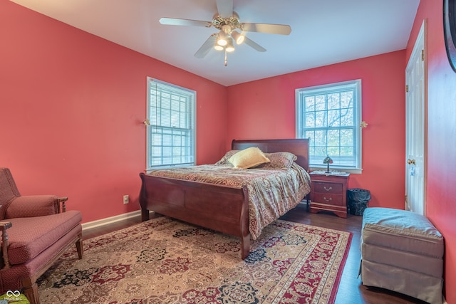 bedroom featuring ceiling fan and dark hardwood / wood-style flooring