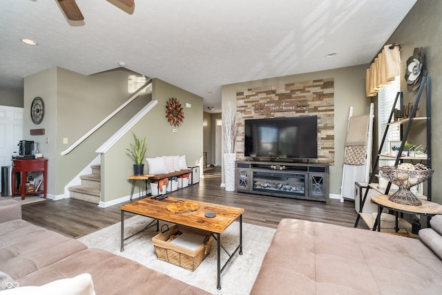 living room with a healthy amount of sunlight, a textured ceiling, hardwood / wood-style flooring, and ceiling fan