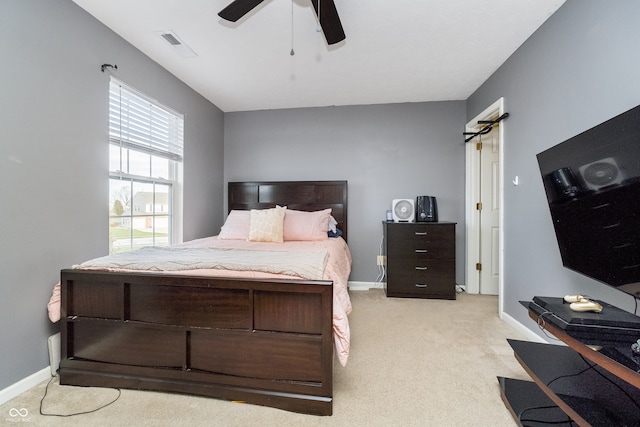 bedroom featuring light carpet and ceiling fan