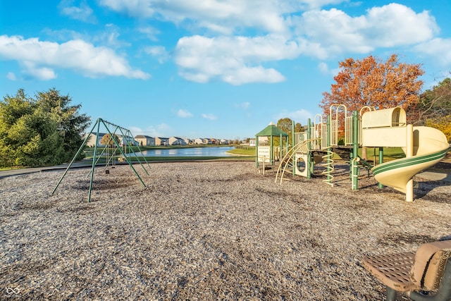 view of playground with a water view