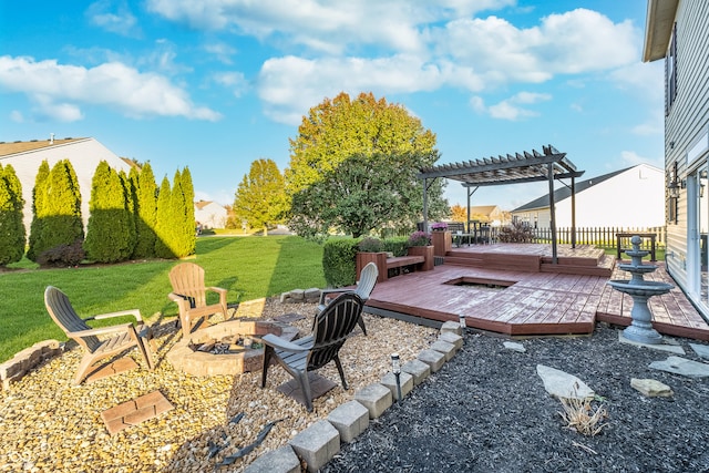 view of yard with a pergola, a fire pit, and a wooden deck