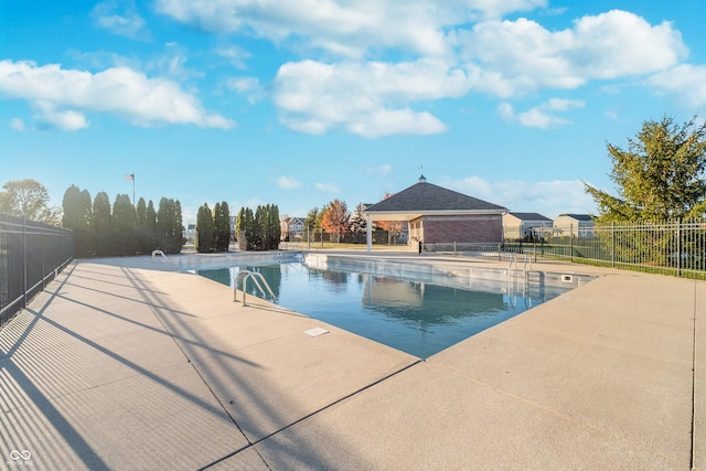 view of swimming pool featuring a patio area