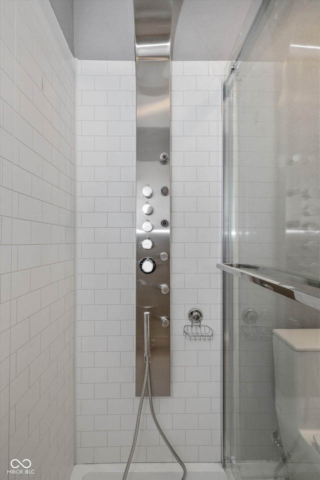 bathroom featuring an enclosed shower