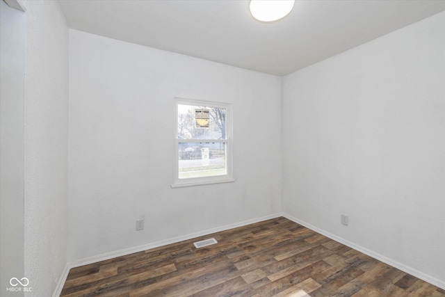 unfurnished room with dark hardwood / wood-style floors