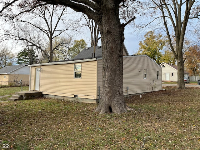 view of property exterior with a lawn