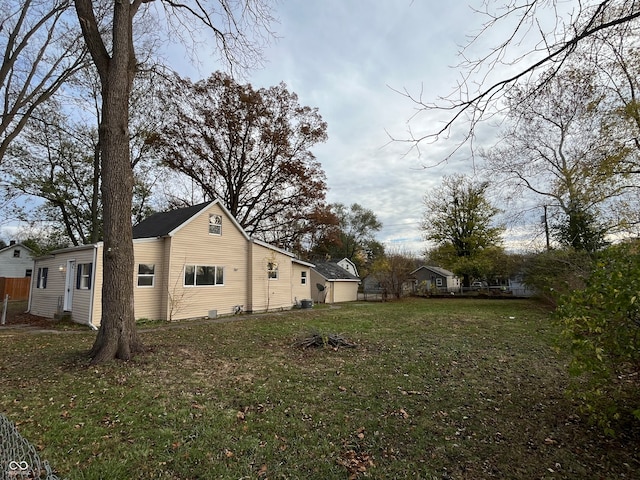 view of home's exterior with a yard