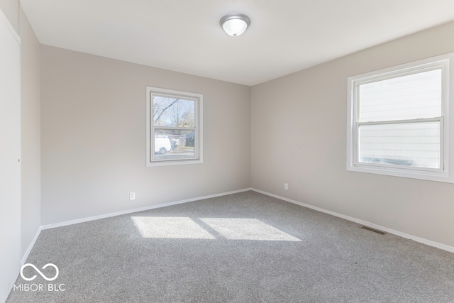 spare room featuring carpet