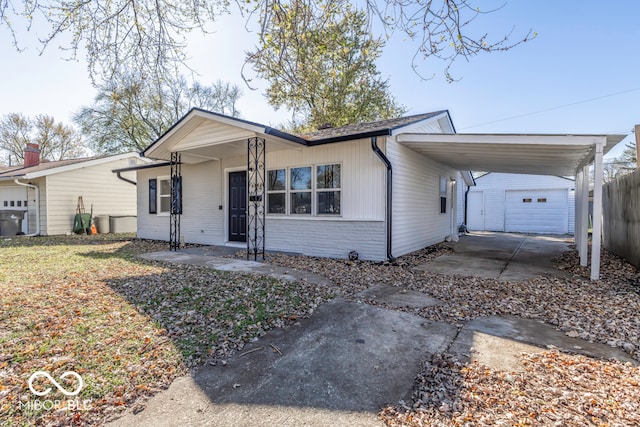 single story home with covered porch and a carport