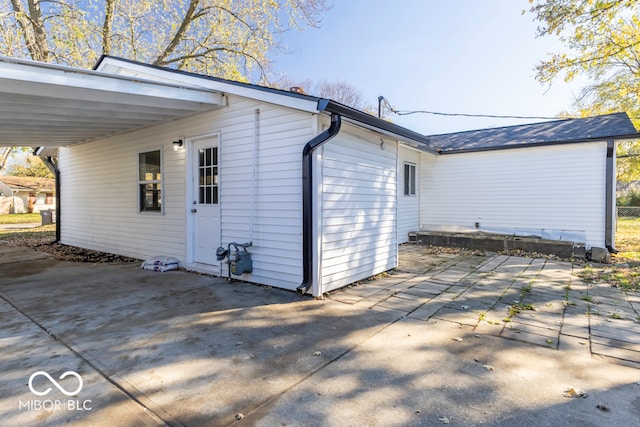 view of side of property featuring a carport