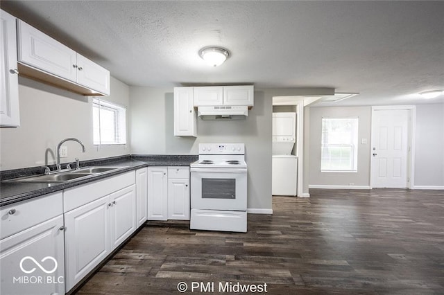 kitchen featuring stacked washing maching and dryer, white cabinetry, plenty of natural light, and white range with electric cooktop