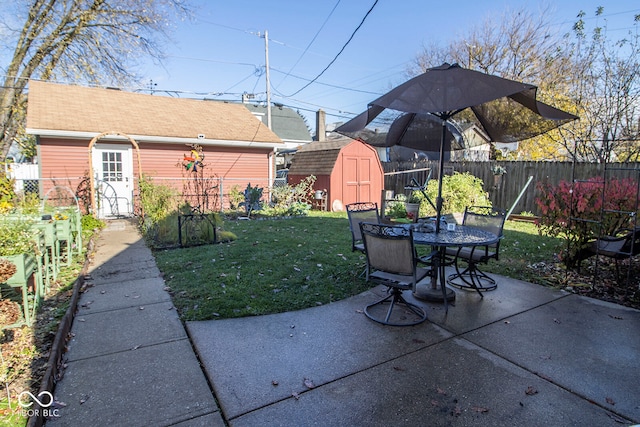 view of yard with a patio and a shed