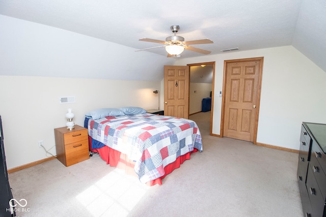 carpeted bedroom with a textured ceiling, ceiling fan, and lofted ceiling