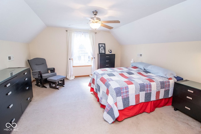 carpeted bedroom featuring ceiling fan and vaulted ceiling