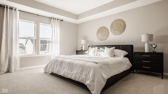 bedroom featuring light colored carpet