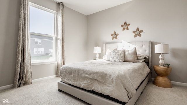 bedroom with light colored carpet