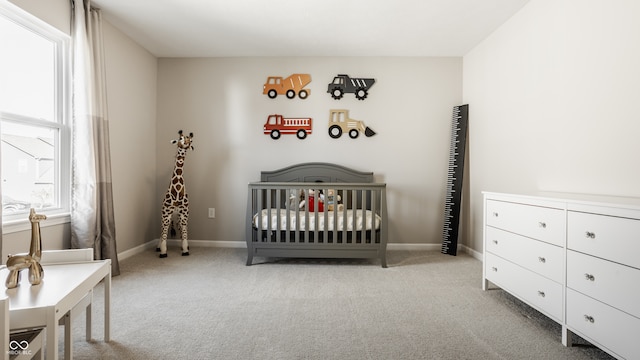 carpeted bedroom with a crib