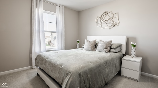 carpeted bedroom with multiple windows