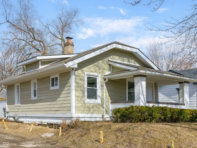 view of side of property featuring a chimney