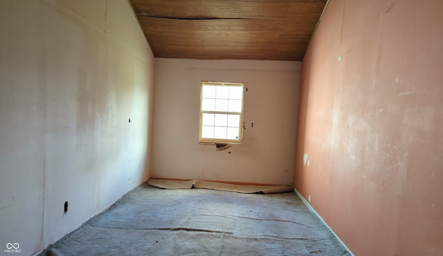 empty room with wood ceiling