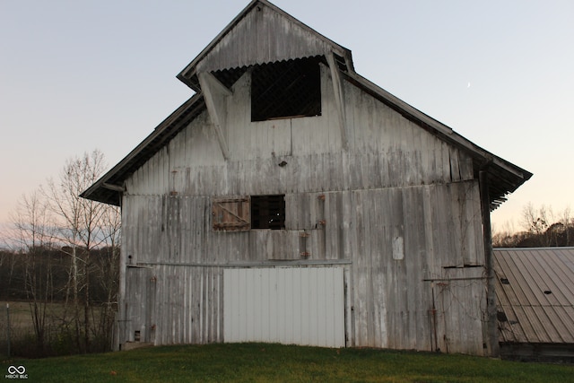 view of outdoor structure at dusk