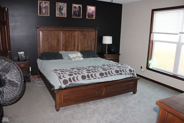 bedroom featuring light colored carpet