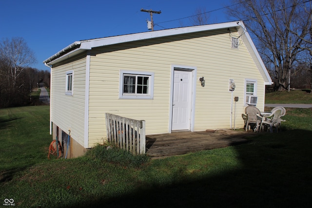 back of property featuring a patio and a yard