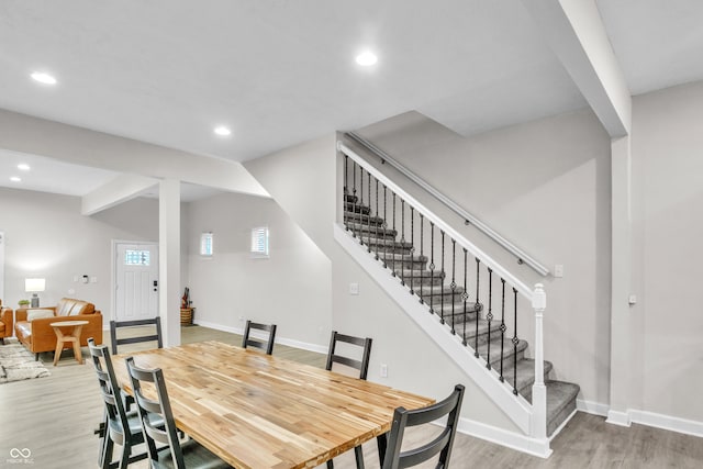 dining space with light hardwood / wood-style flooring