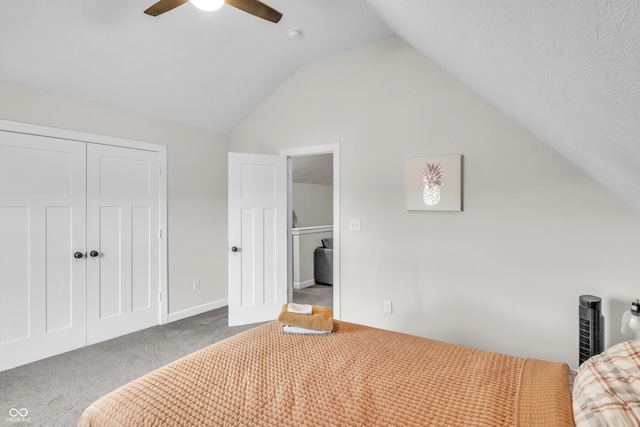 unfurnished bedroom with carpet floors, a closet, ceiling fan, and lofted ceiling