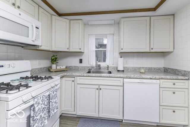 907 S E St, Indianapolis, IN 46225 - kitchen featuring white appliances, light countertops, backsplash, and dark wood finished floors