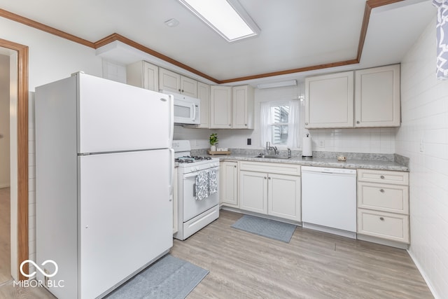 kitchen featuring white appliances, white cabinets, sink, light hardwood / wood-style flooring, and ornamental molding