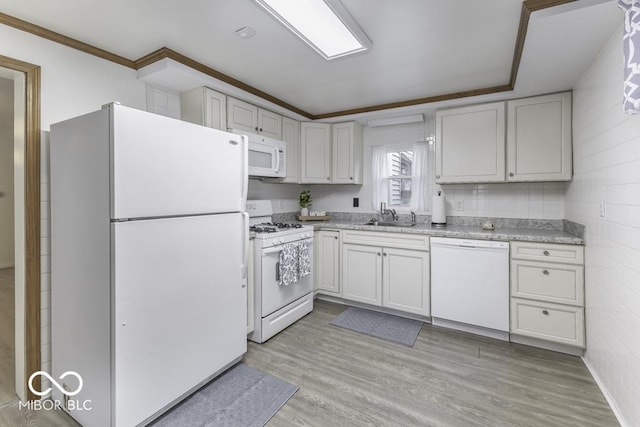 907 S E St, Indianapolis, IN 46225 - kitchen with white appliances, light countertops, light wood-type flooring, crown molding, and white cabinetry