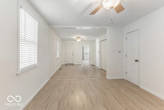 spare room featuring ceiling fan and light wood-type flooring