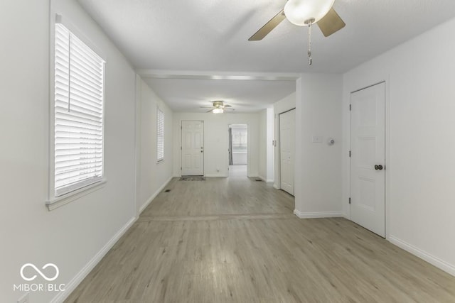 907 S E St, Indianapolis, IN 46225 - unfurnished room featuring a ceiling fan and light wood finished floors