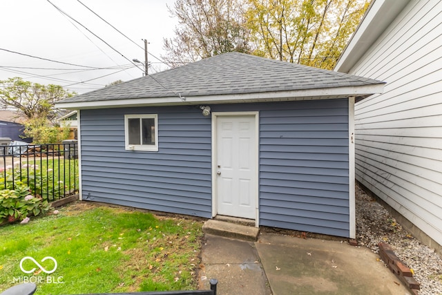 view of outbuilding featuring a yard