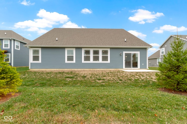 back of house featuring a patio area and a yard