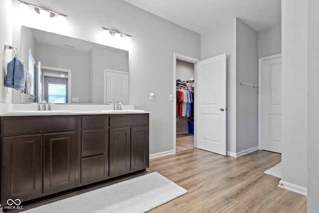 bathroom featuring hardwood / wood-style floors and vanity