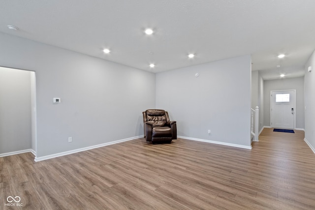 unfurnished room with light hardwood / wood-style floors