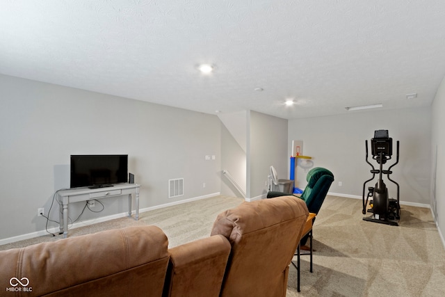 living room with light colored carpet and a textured ceiling