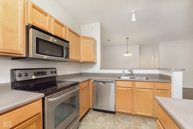 kitchen with sink, light brown cabinets, an inviting chandelier, pendant lighting, and appliances with stainless steel finishes