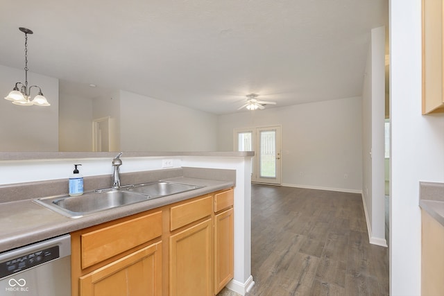 kitchen featuring stainless steel dishwasher, ceiling fan with notable chandelier, sink, dark hardwood / wood-style floors, and hanging light fixtures