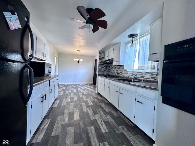 kitchen featuring sink, dark wood-type flooring, backsplash, black appliances, and white cabinets