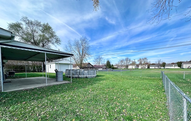 view of yard featuring a covered pool