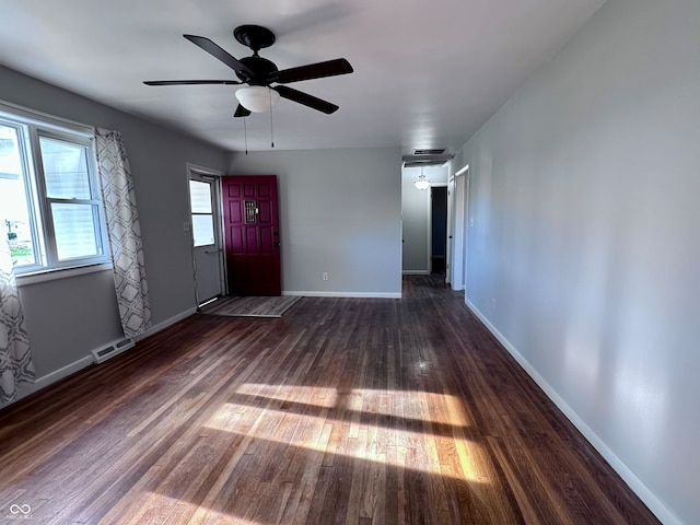 interior space with dark hardwood / wood-style floors and ceiling fan