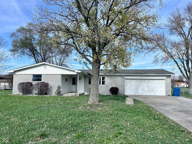 ranch-style house featuring a garage and a front yard