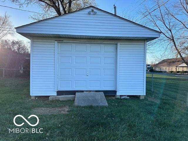 garage featuring a lawn