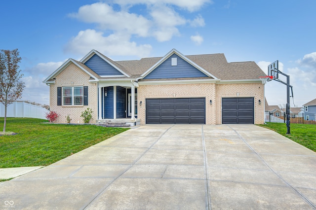 view of front of house featuring a garage and a front lawn