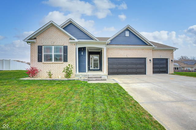 view of front facade with a front yard and a garage